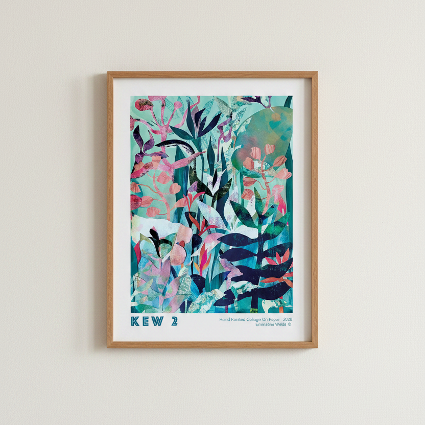 A framed botanical art print featuring a colorful abstract tropical leaf pattern in shades of teal, pink, navy, and green, housed in a light oak wood frame and mounted on a neutral off-white wall.